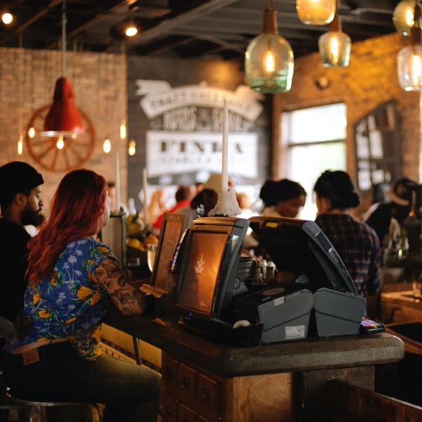 Diners and servers in a restaurant.