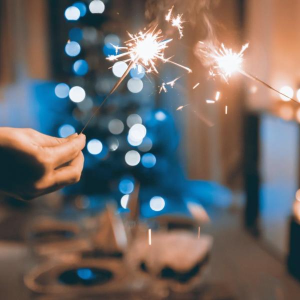 people holding sparklers