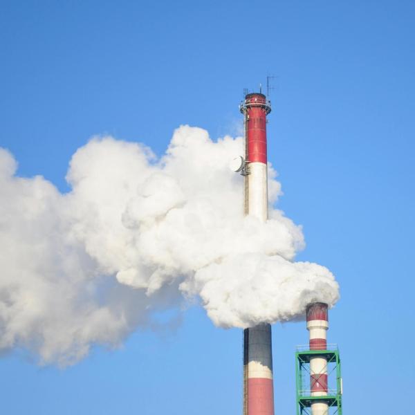 Smoke Stacks Against Blue Sky