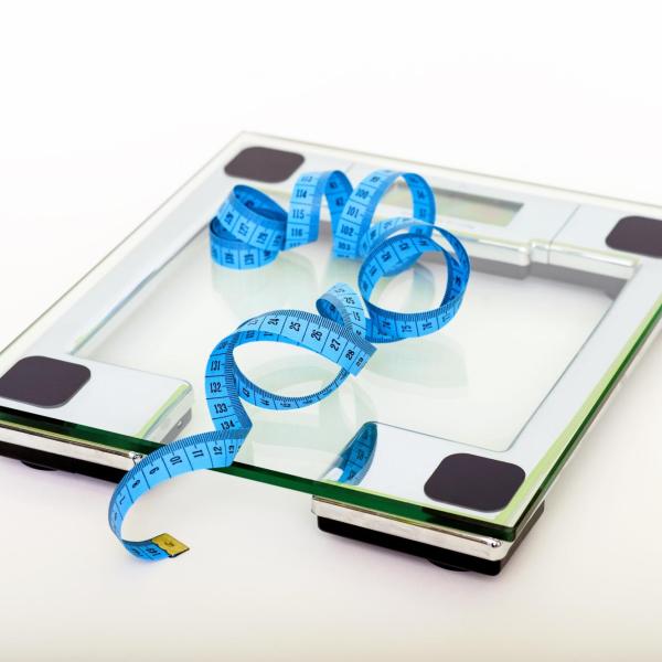Bathroom scale and tape measurer