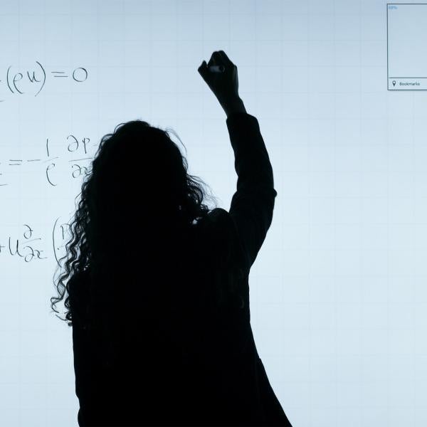 A woman writing notes