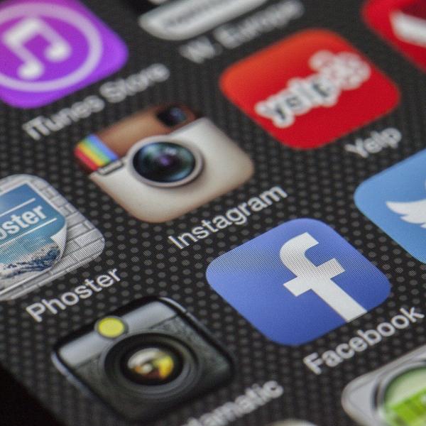 cell phone screen with social media icons