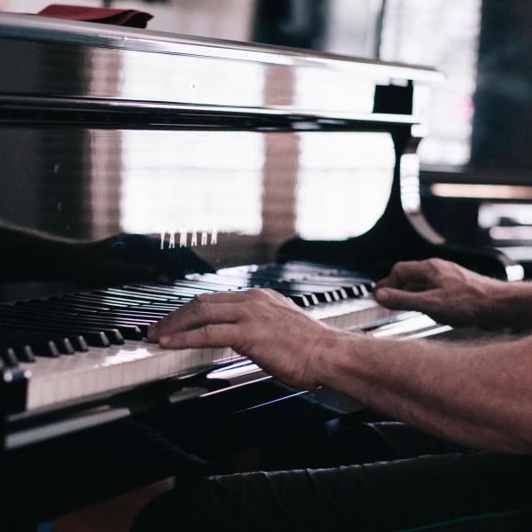 Hands playing piano