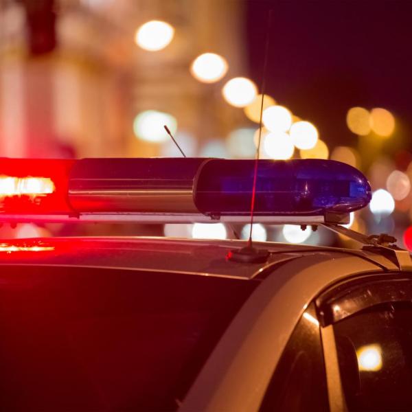 Police car with sirens at night