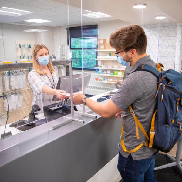 student filling a prescription on campus