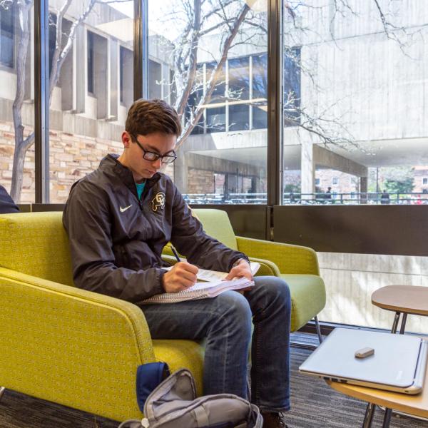 student studying on campus
