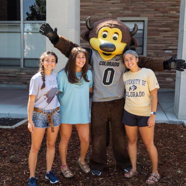 Students and Chip pose for a photo during move-in
