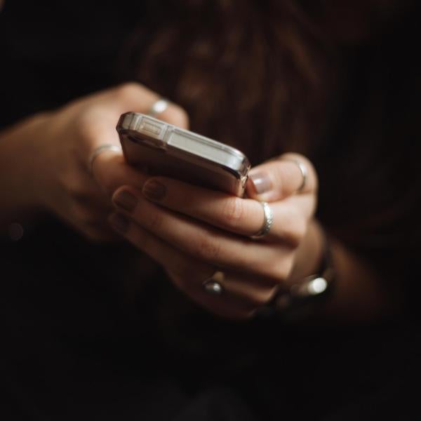 person reads a message on their phone