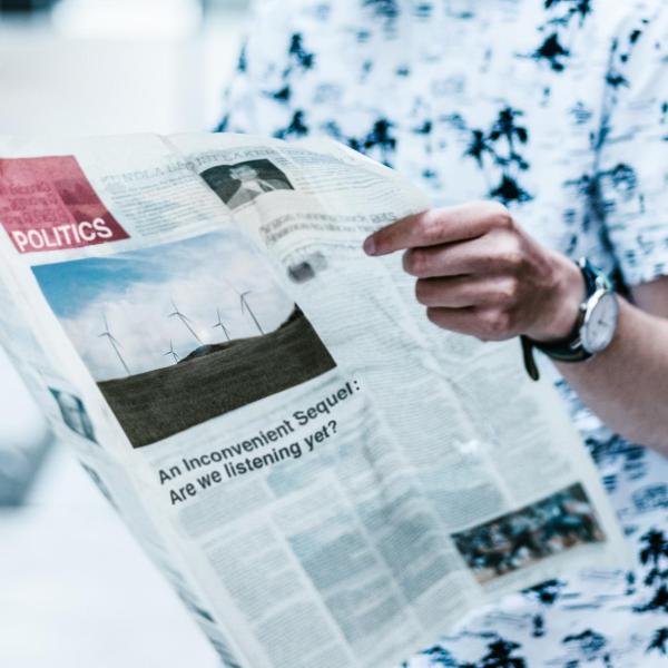 Man holding newspaper
