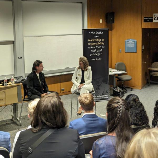 Entrepreneur David Adelman speaking with business students