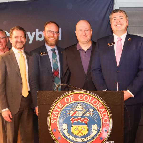 CU President Todd Saliman and Gov. Jared Polis, among others, at the quantum press conference