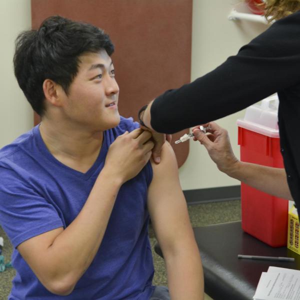 A student getting a flul shot
