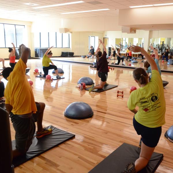 Students participate in fitness class at The Rec Center