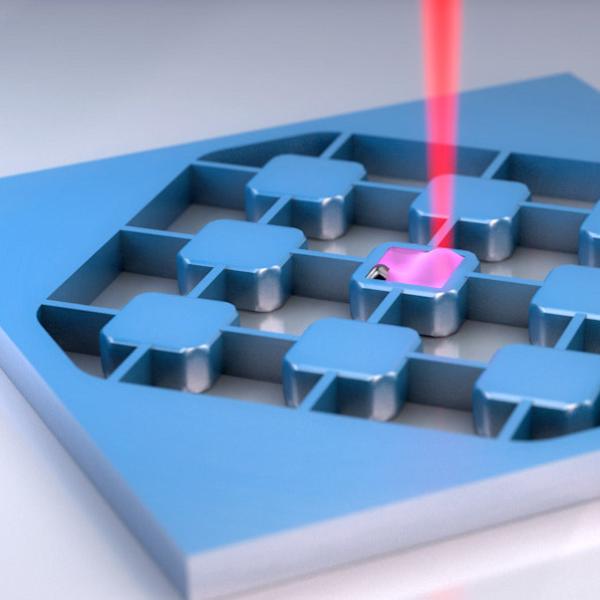 Artist's depiction of an electro-optic transducer, an ultra-thin wafer that can read out the information from a superconducting qubit.