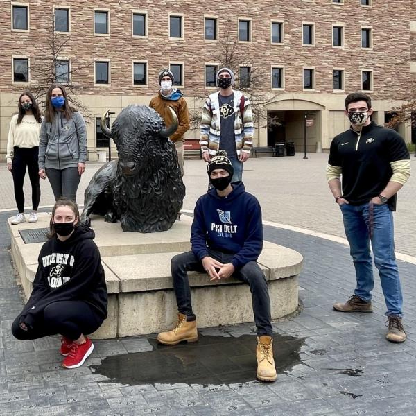Student volunteers in masks on the CU Boulder campus