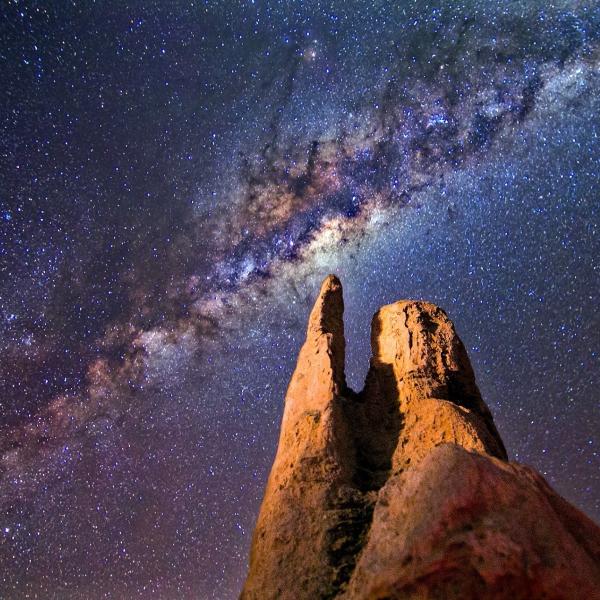 A rock formation on Earth seen during night time (Photo from Pexels)