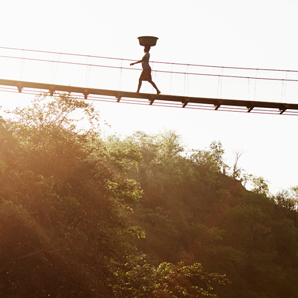 A person using a trail bridge in Rwanda
