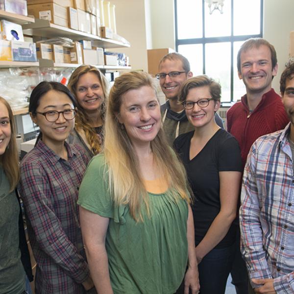 Sara Sayer and students appear in the lab.