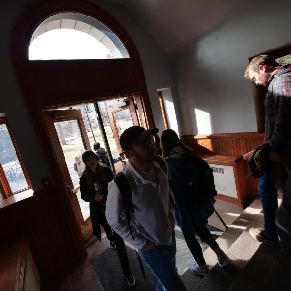 Students file through a doorway in the Hale Science building