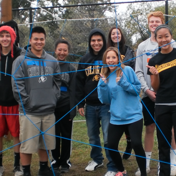 Students standing in an obstacle course