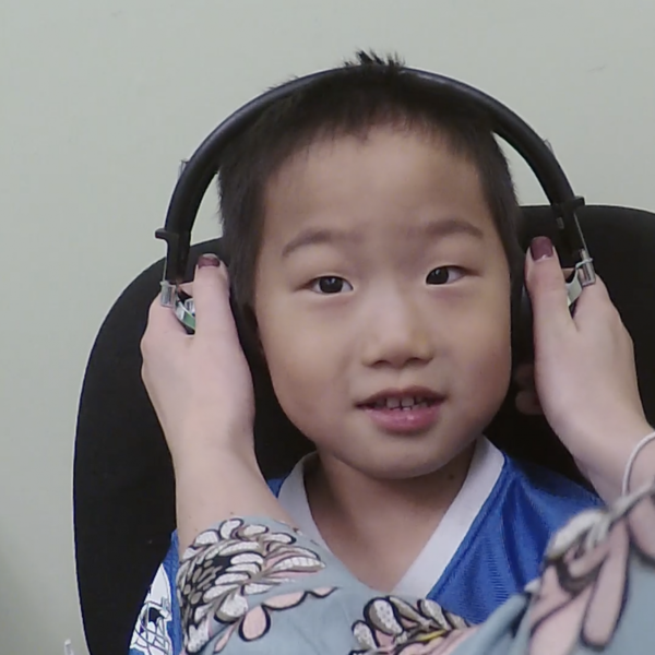 A child having their hearing tested