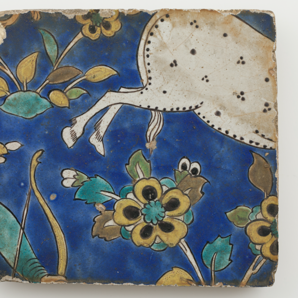 A photo of art depicting flowers and the back hooves and tail of an animal.