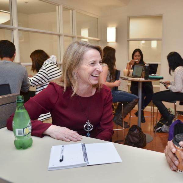 Sharon Matusik working with a student