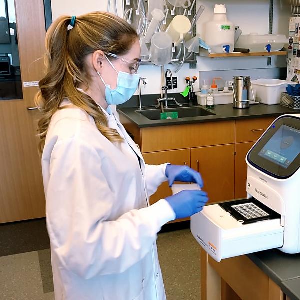 A researcher works in the lab to develop SickStick.