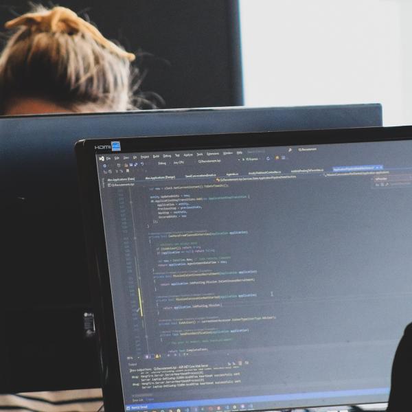 People coding at a computer