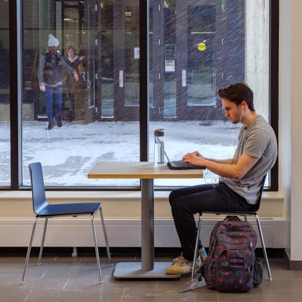 Student studying inside new Rustandy addition