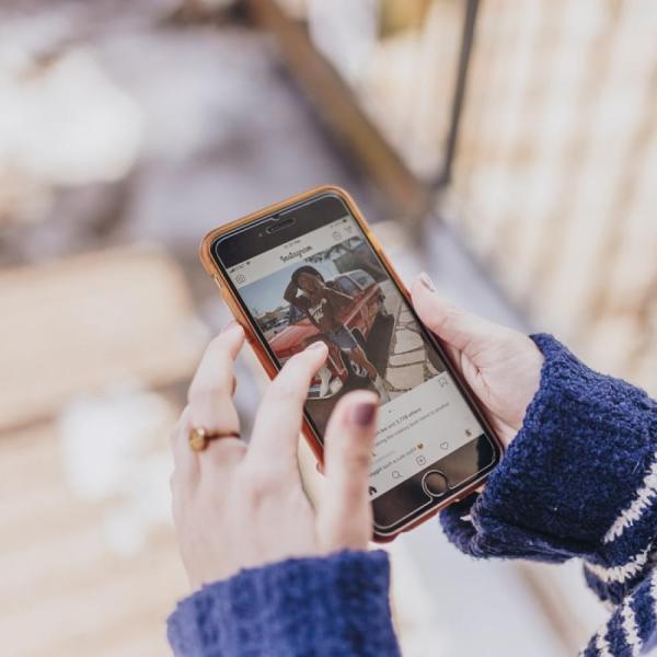 Person scrolling on Instagram