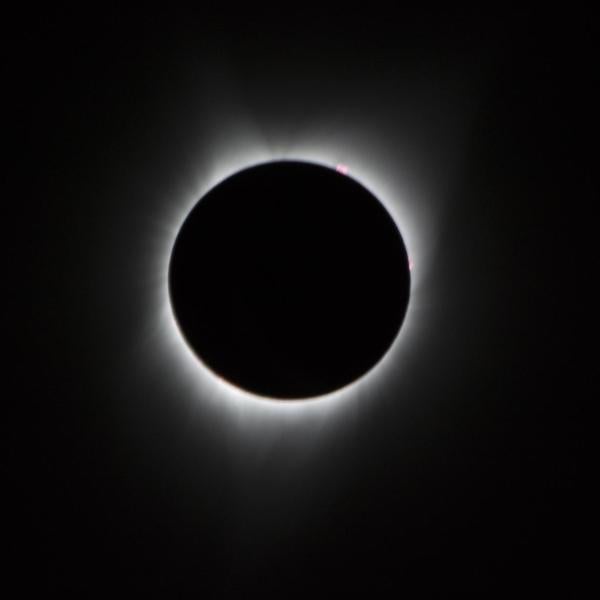 Image of the sun fringed in white light as seen during an eclipse
