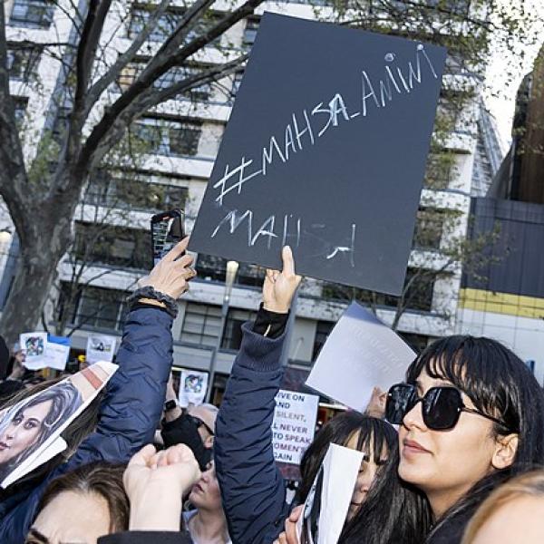 A protest sign shows #mahsaamini. (Wikimedia Commons/Matt Hrkac from Geelong/Melbourne, Australia)