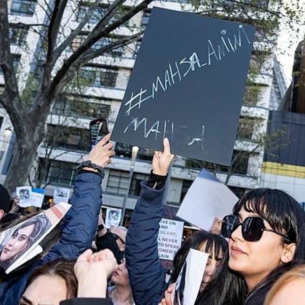 People holding signs of protest.
