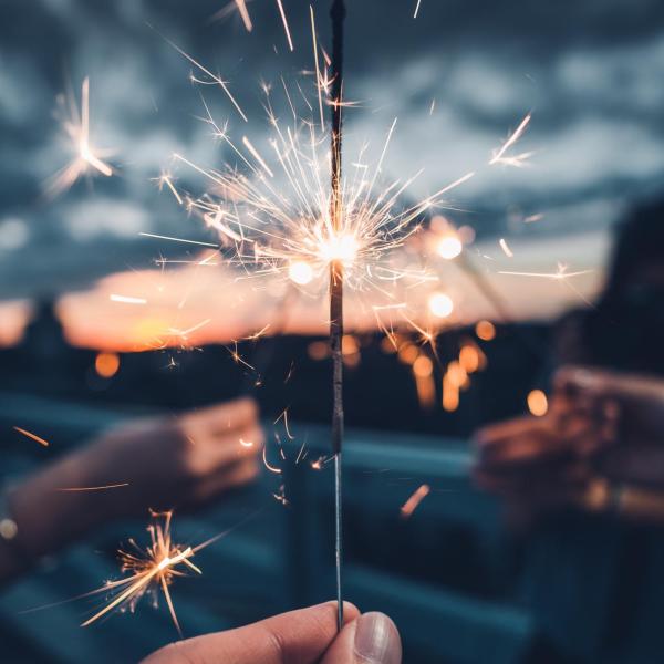 A person holding a sparkler