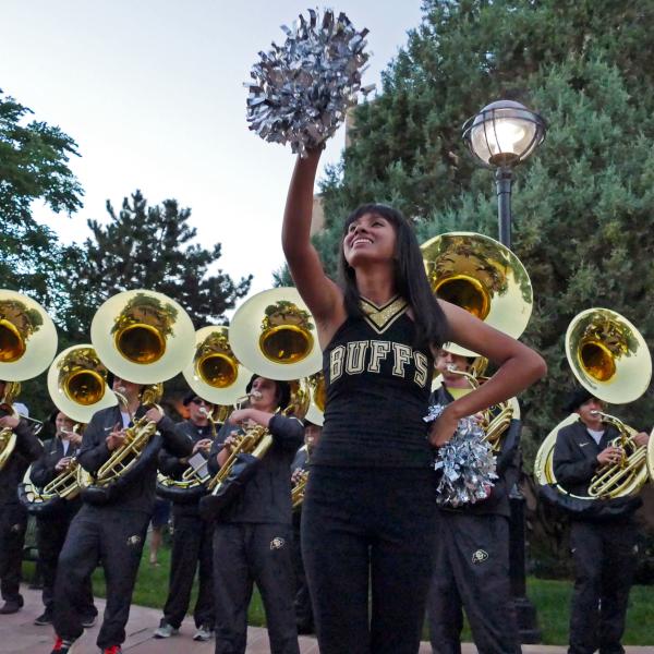 CU Boulder homecoming Stampede with marching band downtown
