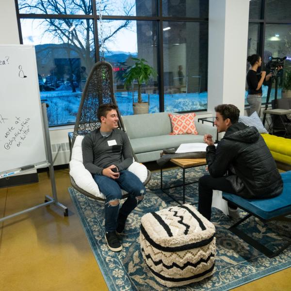 students chatting at a campus event
