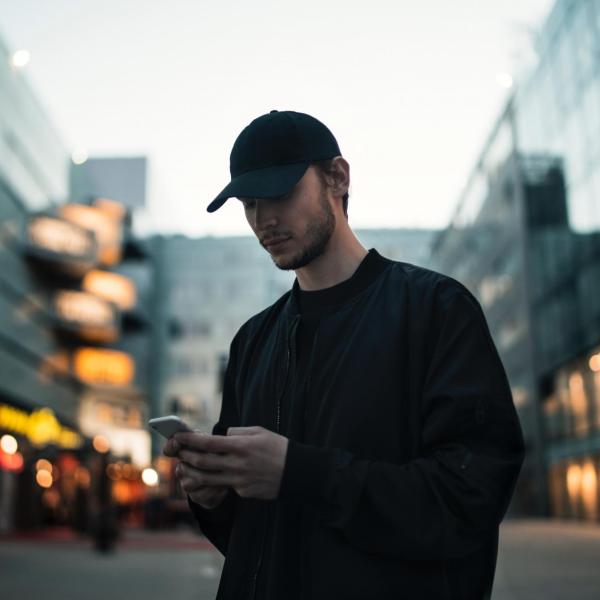 Stock image of a man looking at a phone