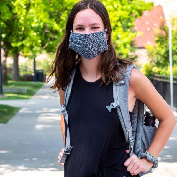 Student wearing a mask on campus