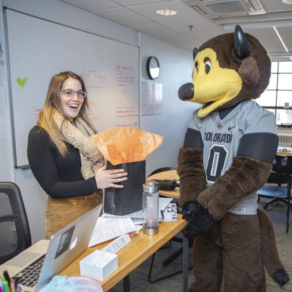 Chip the buffalo mascot gifting an employee