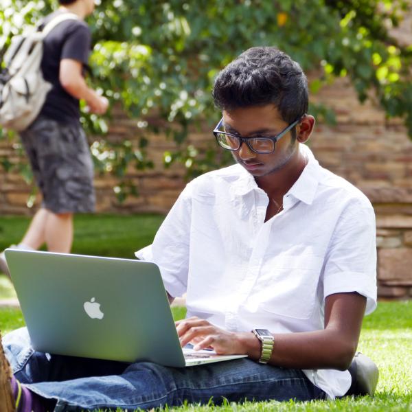 A student using a laptop computer