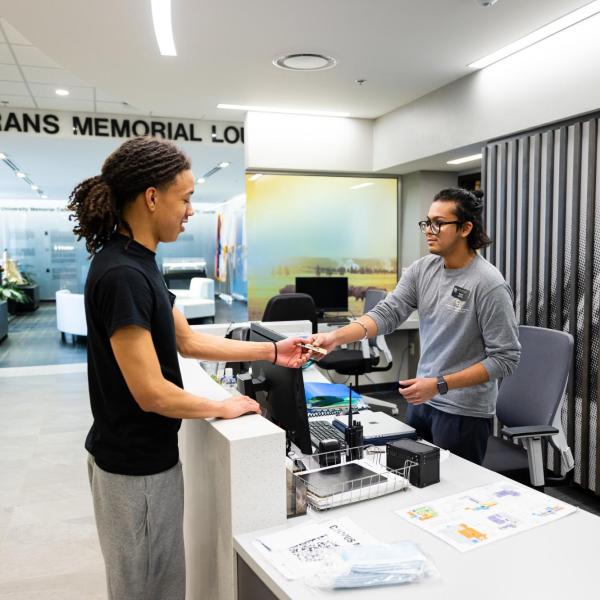 Student employee working at the UMC front desk