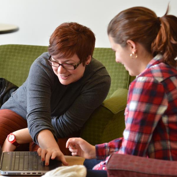 Student employee tutoring another student