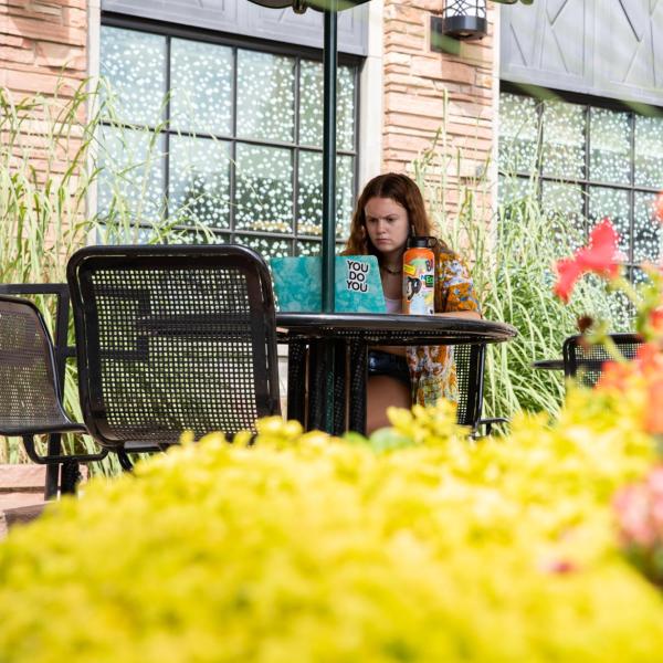 student studying on campus