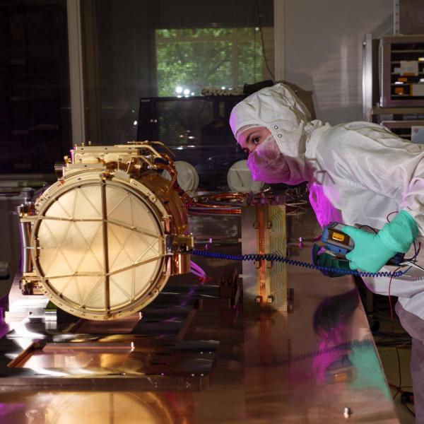 Engineer inspects SUDA instrument in a clean room