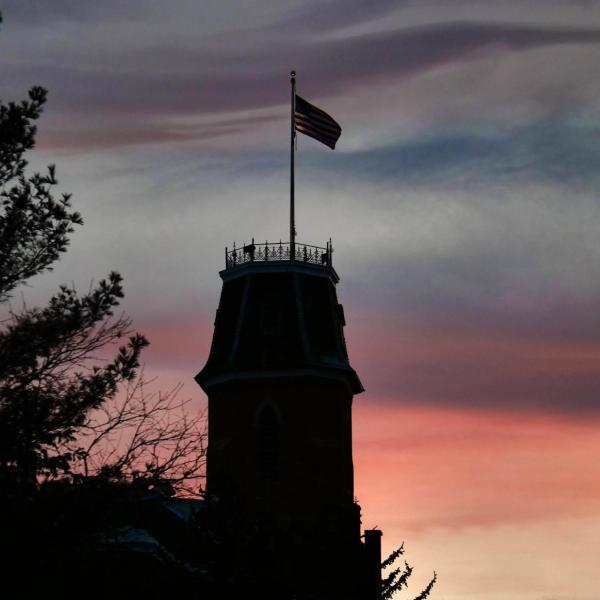silhouette of Old Main building at sunset