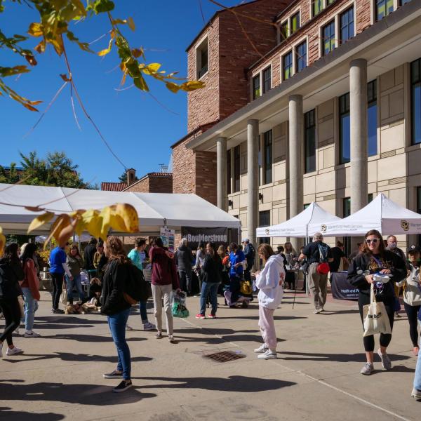 Campus community members attend the Take Care Street Fair