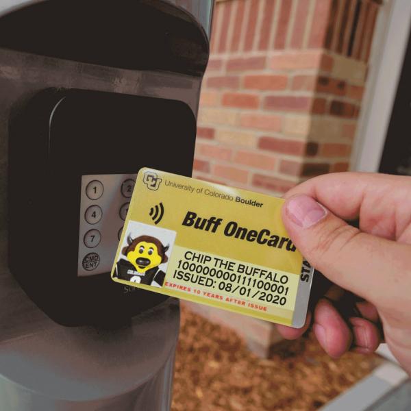 Person tapping their Buff OneCard for building access