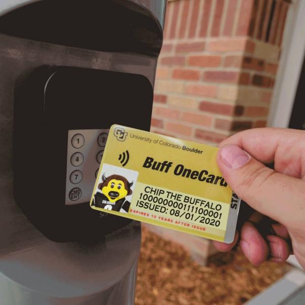 Person tapping their Buff OneCard for building access