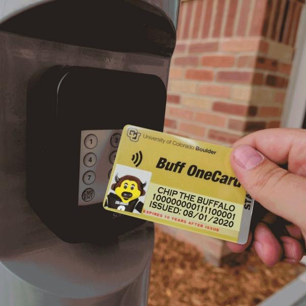 Person tapping their Buff OneCard for building access